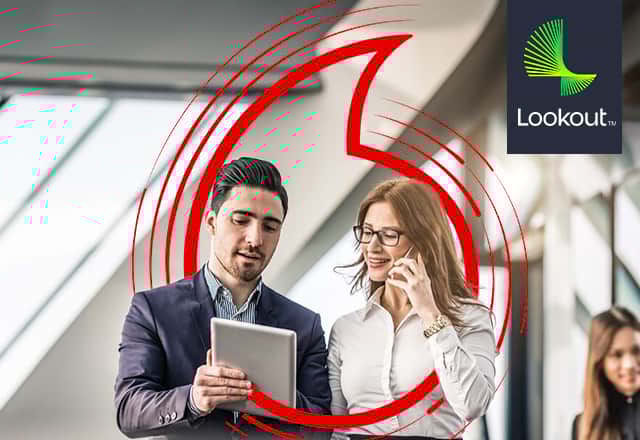Woman on phone and man looking at tablet