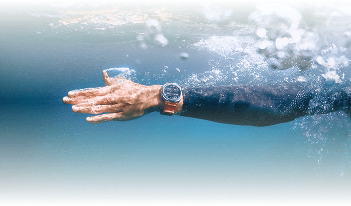 Person swimming wearing watch