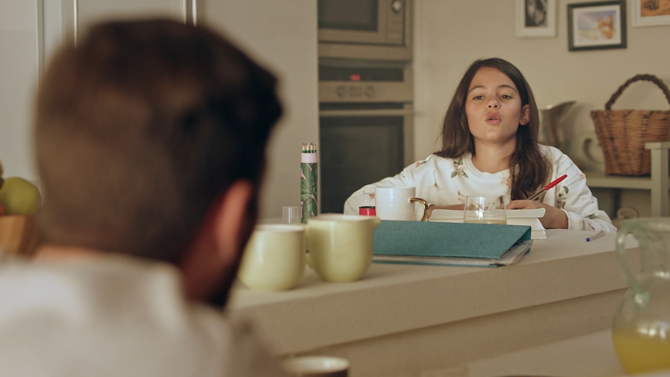 Young girl at a kitchen table