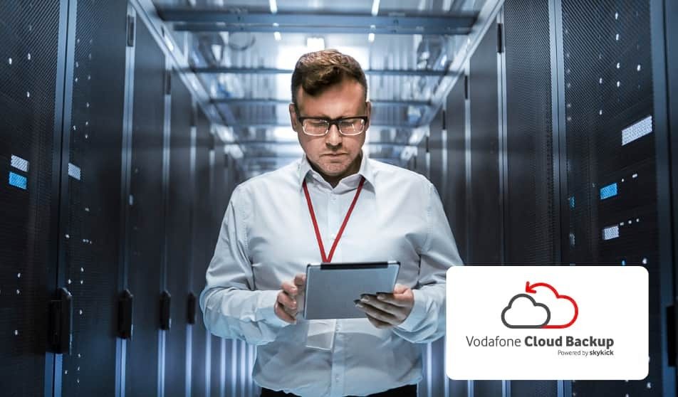 Vodafone Cloud Backup Man on tablet in data warehouse