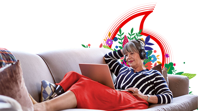 woman on laptop on couch woman on laptop on couch